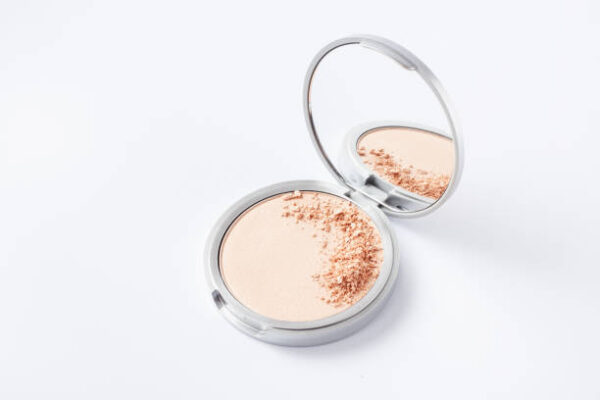 Beautiful eyeshadow palette on white with crushed sample. makeup product.